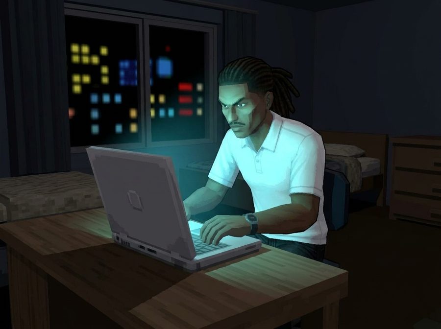 Malik travaille de nuit sur son ordinateur